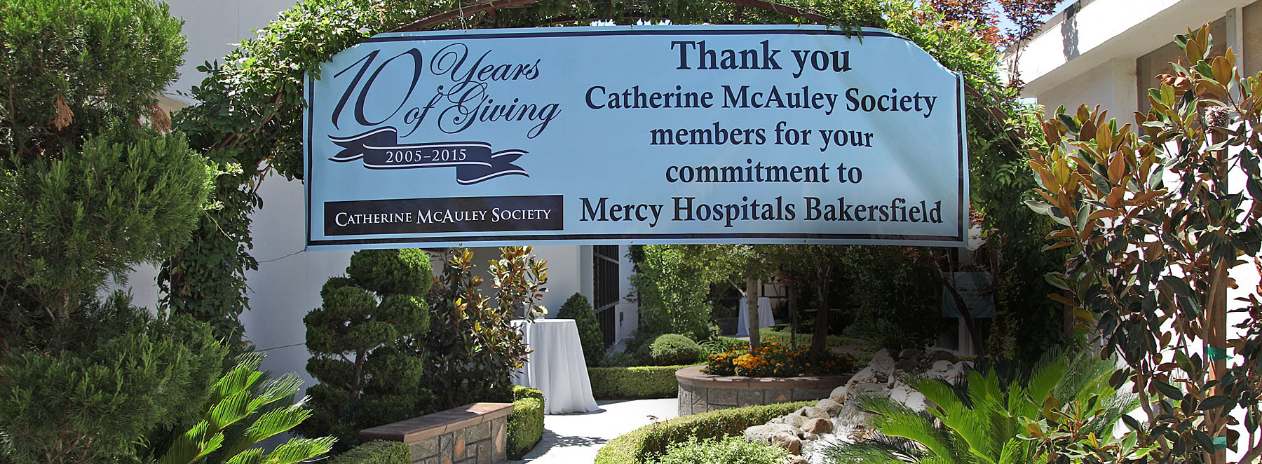 Catherine McAuley banner outside in garden area