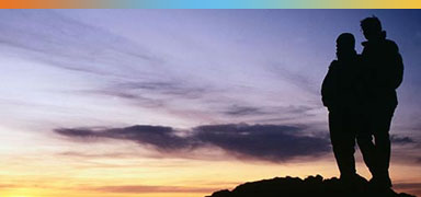 Two people silhouette on mountain